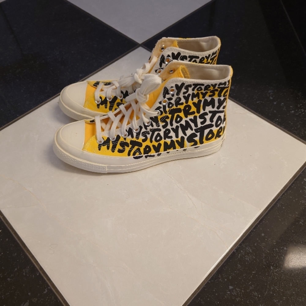 Converse Yellow and Black High-Top Sneakers